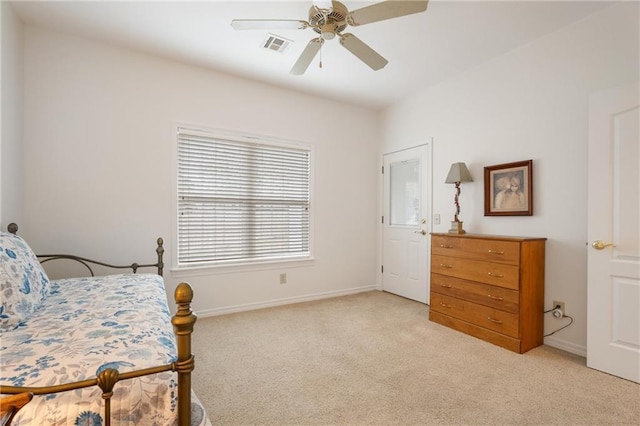 bedroom featuring light carpet, a ceiling fan, visible vents, and baseboards