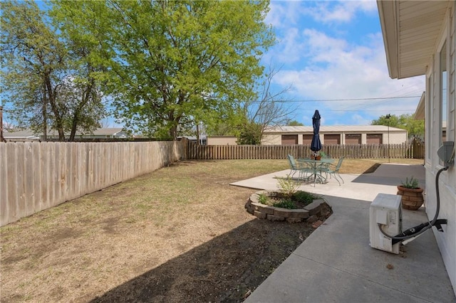 view of yard with a fenced backyard and a patio