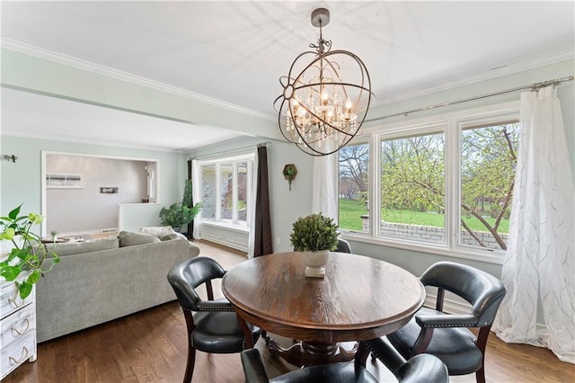 dining room featuring ornamental molding, dark wood-style floors, and a chandelier