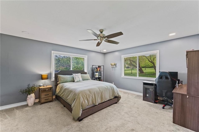 bedroom with carpet flooring, baseboards, and ceiling fan