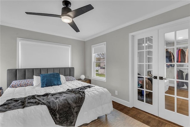 bedroom featuring french doors, ornamental molding, wood finished floors, baseboards, and ceiling fan
