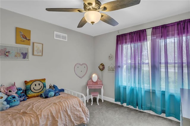 bedroom with carpet flooring, a ceiling fan, and baseboards