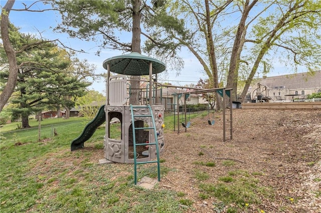 community jungle gym with a yard
