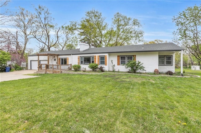 6025 Nall Ave, Mission, KS 66202 - view of front of house featuring concrete driveway, a garage, a chimney, and a front yard