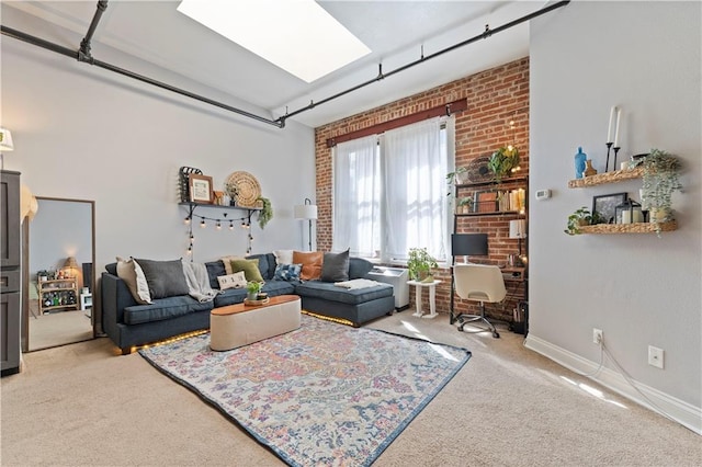 308 W 8th St Unit 505, Kansas City, MO 64105 - living area featuring baseboards, light colored carpet, and brick wall