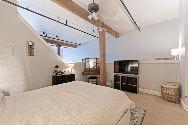 308 W 8th St Unit 505, Kansas City, MO 64105 - carpeted bedroom with baseboards, ceiling fan, and beam ceiling