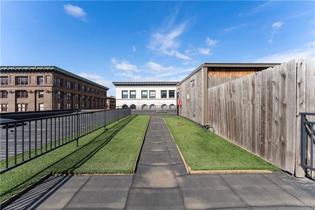 308 W 8th St Unit 505, Kansas City, MO 64105 - view of property's community with a lawn and fence