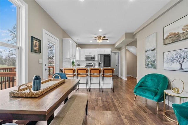 200 NW 180th St, Smithville, MO 64089 - dining area featuring dark wood-type flooring, recessed lighting, ceiling fan, and baseboards