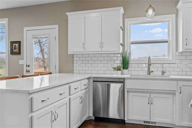 200 NW 180th St, Smithville, MO 64089 - kitchen with dishwasher, a sink, a peninsula, and white cabinets