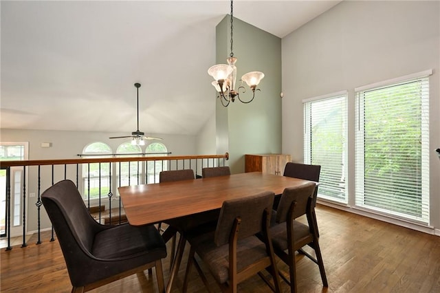 1216 SE Meridian Dr, Lees Summit, MO 64081 - dining room featuring high vaulted ceiling, a ceiling fan, dark wood-type flooring, and a chandelier
