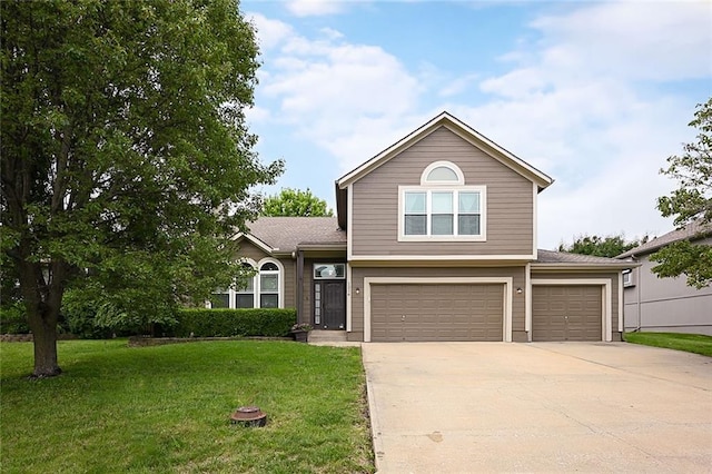 1216 SE Meridian Dr, Lees Summit, MO 64081 - view of front of home with driveway, a front lawn, and an attached garage