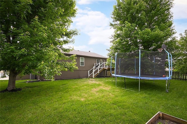 1216 SE Meridian Dr, Lees Summit, MO 64081 - view of yard with stairway and a trampoline