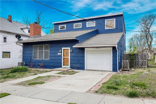 traditional home featuring cooling unit, fence, roof with shingles, and driveway