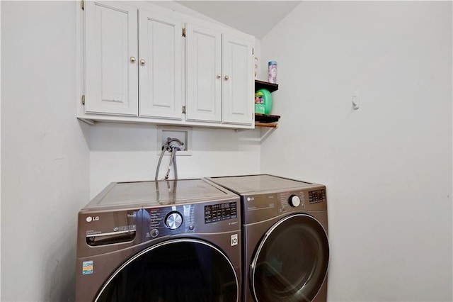 laundry room featuring washer and dryer and cabinet space