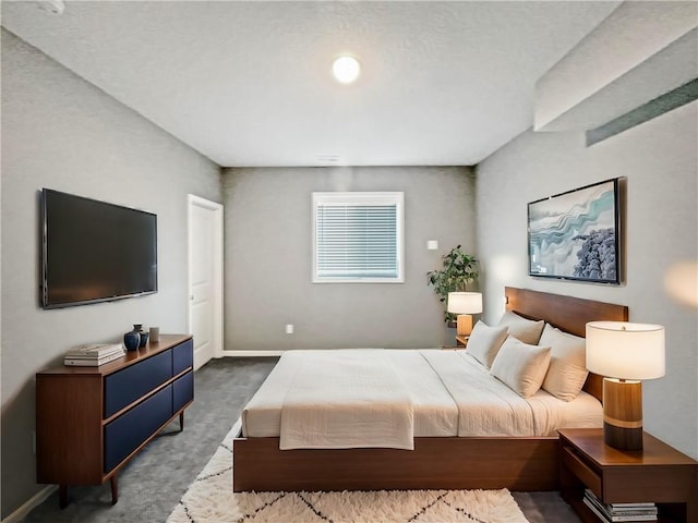 bedroom featuring baseboards and carpet flooring