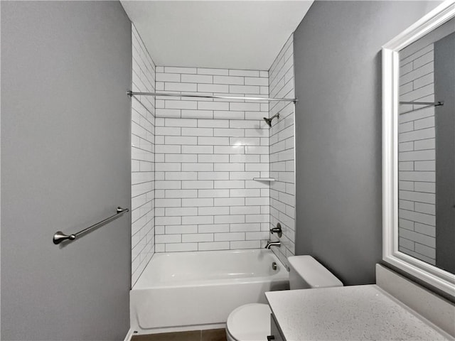 bathroom with toilet, vanity, and shower / washtub combination