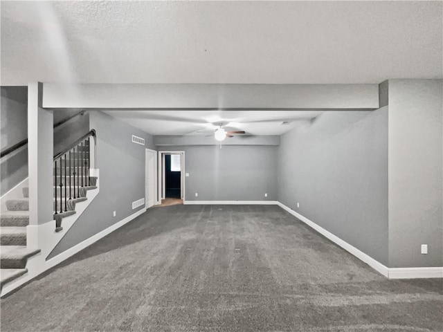 interior space with carpet flooring, stairway, a ceiling fan, baseboards, and visible vents