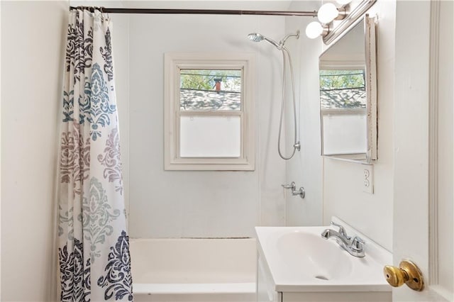 bathroom featuring vanity and shower / tub combo with curtain