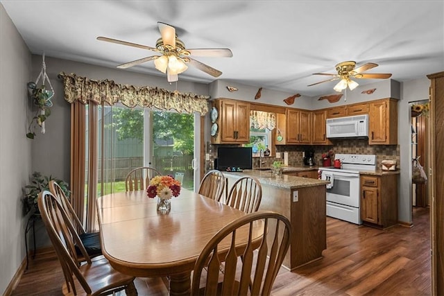 9111 Allman Rd, Lenexa, KS 66219 - dining room featuring ceiling fan, healthy amount of natural light, and dark wood finished floors