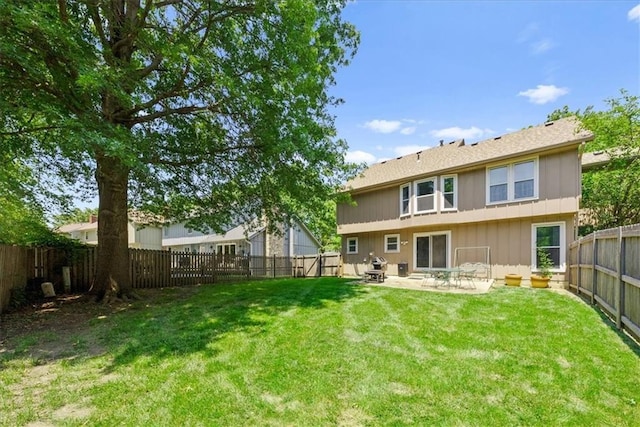 9111 Allman Rd, Lenexa, KS 66219 - back of house featuring a fenced backyard, a patio, and board and batten siding