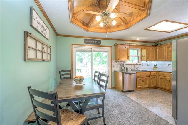 dining space featuring ornamental molding, a ceiling fan, and light colored carpet