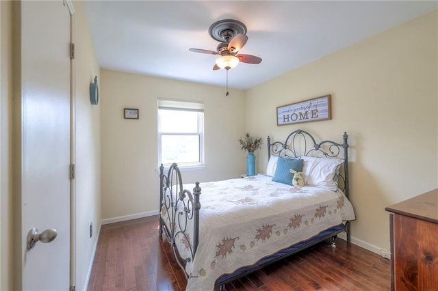 bedroom featuring hardwood / wood-style flooring, baseboards, and a ceiling fan