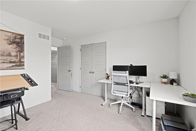 home office with baseboards, carpet floors, and visible vents