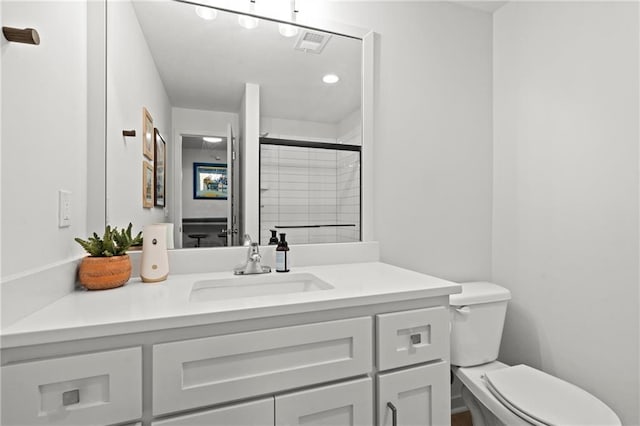 full bathroom featuring visible vents, toilet, and vanity