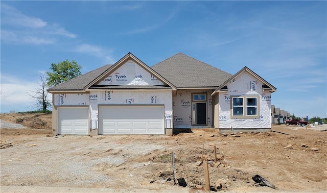 6938 NE 102nd St, Kansas City, MO 64156 - property under construction featuring an attached garage and stucco siding