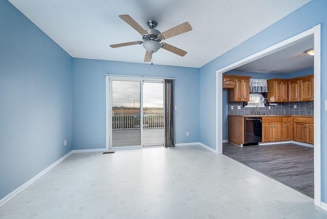953 N Hickory Dr, Tonganoxie, KS 66086 - unfurnished living room featuring light flooring, a ceiling fan, and baseboards