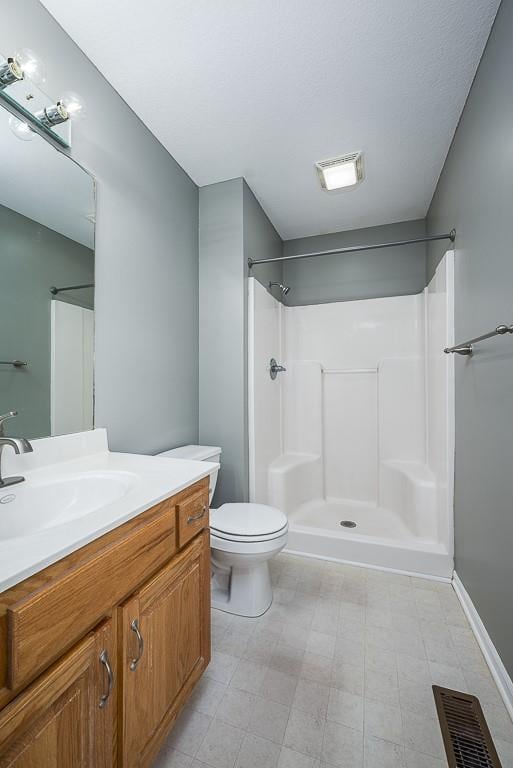 953 N Hickory Dr, Tonganoxie, KS 66086 - full bathroom with vanity, tile patterned floors, a shower, and toilet
