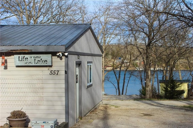 view of outbuilding featuring a water view
