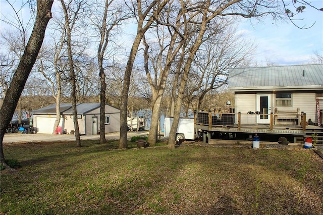 view of yard featuring a wooden deck