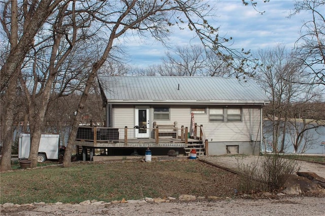 view of front of house featuring a deck and metal roof