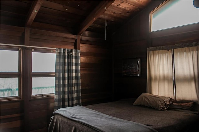 bedroom featuring wooden ceiling, wood walls, and vaulted ceiling