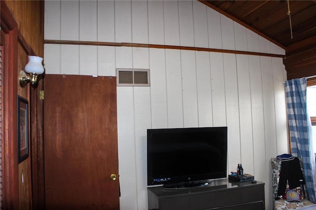 details featuring wooden walls and visible vents