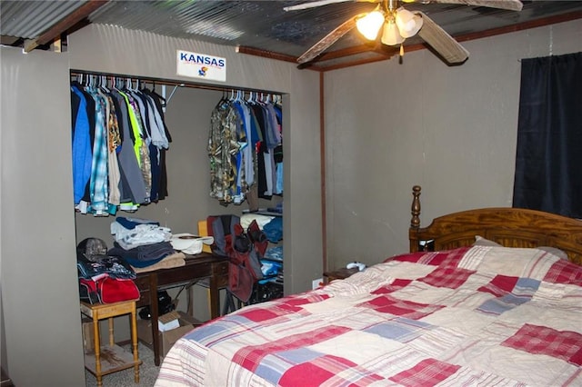carpeted bedroom featuring a closet and a ceiling fan