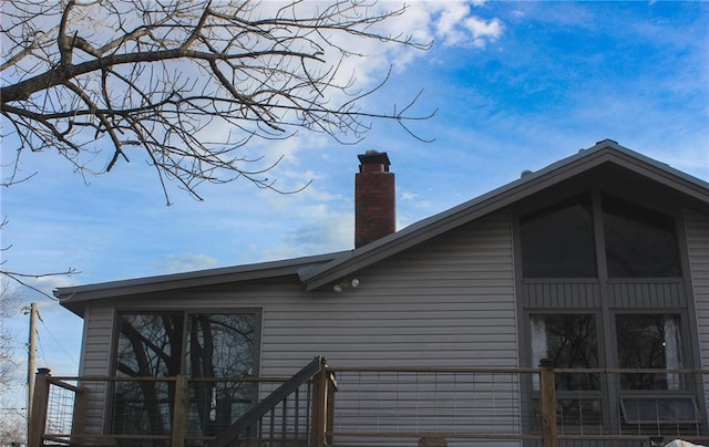 view of side of property with a chimney