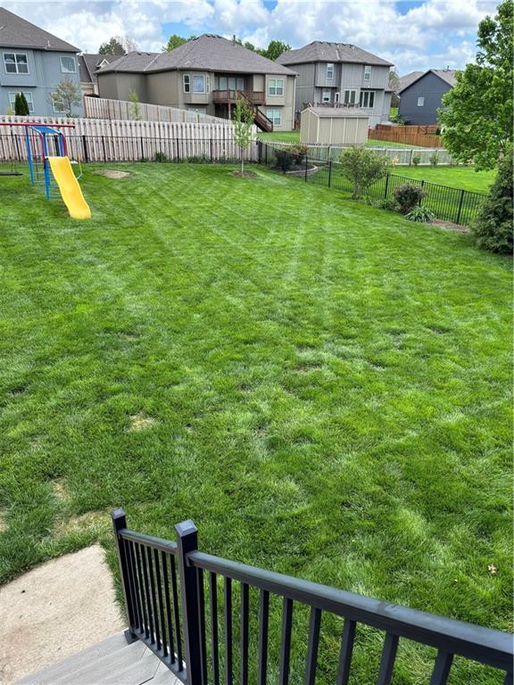 903 Chisam Rd, Kearney, MO 64060 - view of yard featuring a fenced backyard and a residential view