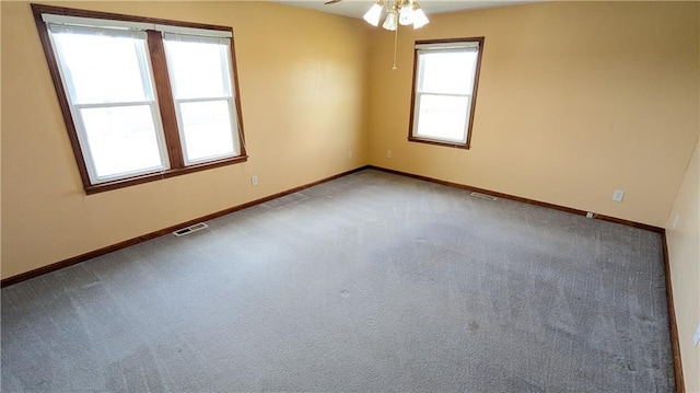 2023 Linden Rd, Hiawatha, KS 66434 - carpeted spare room featuring visible vents, baseboards, and ceiling fan
