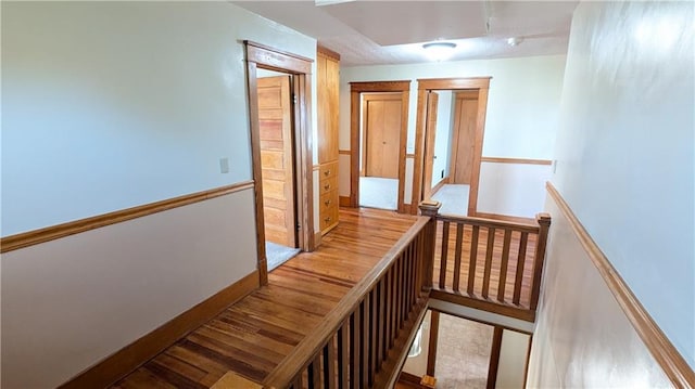 2023 Linden Rd, Hiawatha, KS 66434 - corridor featuring baseboards, wood finished floors, and an upstairs landing