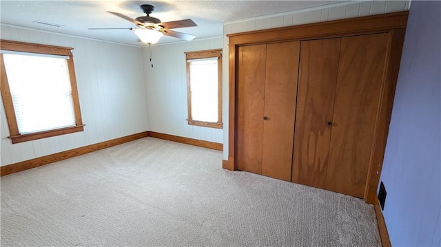 2023 Linden Rd, Hiawatha, KS 66434 - unfurnished bedroom featuring light carpet, a closet, visible vents, and baseboards