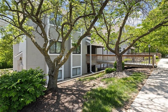 back of property featuring stucco siding