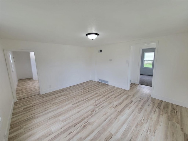 6211 Washington St, Saint Joseph, MO 64504 - unfurnished room featuring baseboards, light wood-style flooring, and visible vents