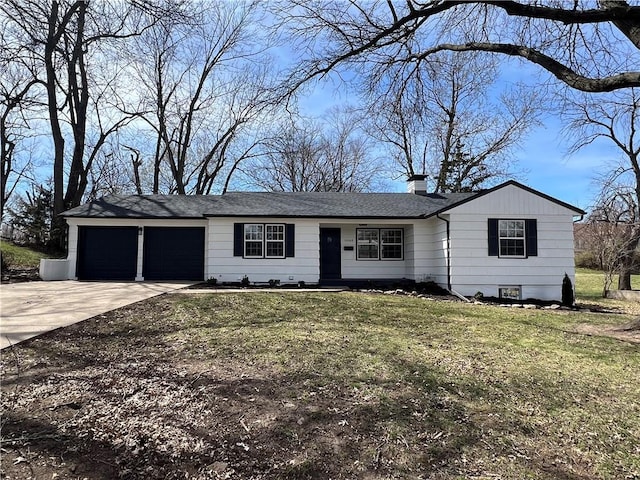 view of front of home featuring a chimney, concrete driveway, a front lawn, and an attached garage
