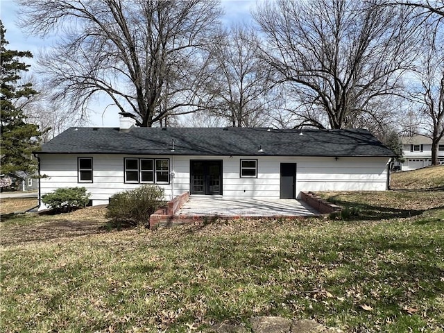 back of property featuring a yard and a patio area