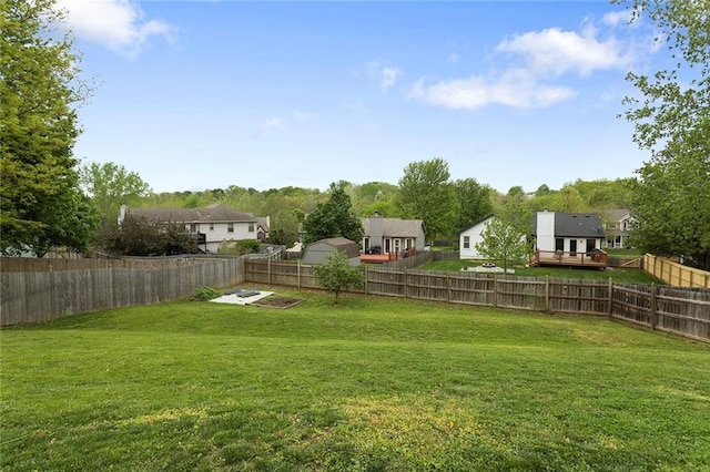 view of yard with a fenced backyard and a wooden deck