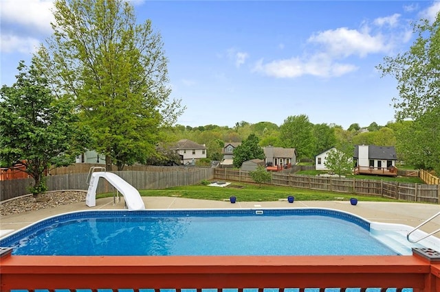view of swimming pool with a patio, a water slide, a fenced backyard, and a fenced in pool