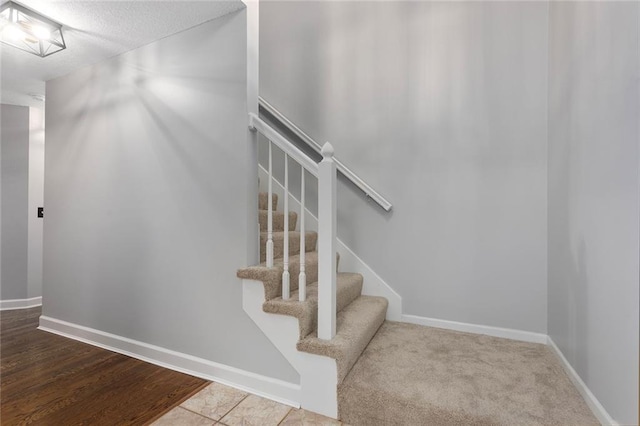 stairs featuring baseboards