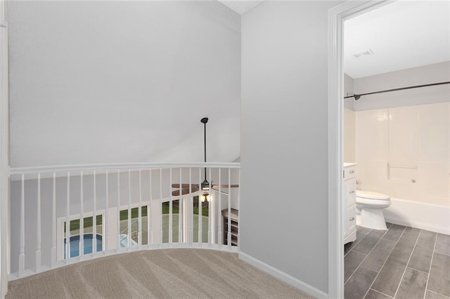 full bathroom featuring tub / shower combination and toilet